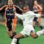 Real Madrid's Brazilian player Roberto Carlos kicks the ball in front of FC Oporto's Folha during early action in their European Champions Cup
  Group D game played Wednesday, december 10, 1997 in Madrid's Santiago Bernabeu stadium. (AP Photo/Denis Doyle)